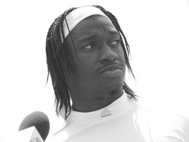 Washington Redskins quarterback Robert Griffin III takes questions from the media after NFL football organized training activity at Redskins Park in Ashburn, Va., Thursday, May 30.