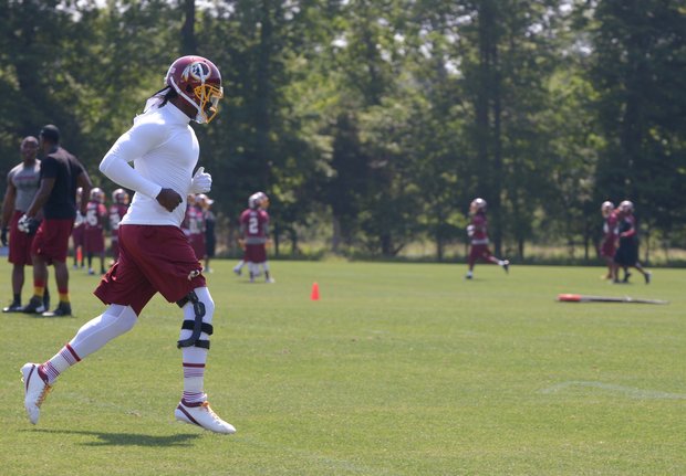 Washington Redskins quarterback Robert Griffin III trained with light running and throwing the football during the organized team activity at Redskins Park in Ashburn, Va., Thursday, May 30.