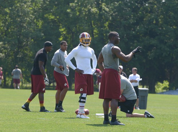 Washington Redskins quarterback Robert Griffin III participates in NFL football team activity at Redskins Park in Ashburn, Va., on Thursday, May 30.