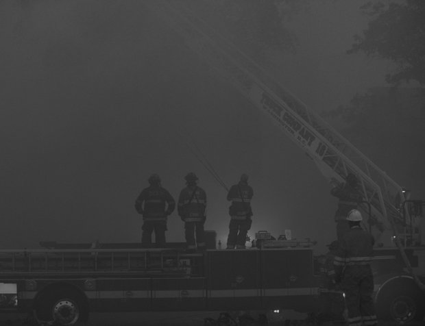 Smoke from the four-alarm fire that destroyed Frager’s Hardware, a Capitol Hill landmark, shadowed the daylight as firefighters fought the blaze on Wed., June 5.