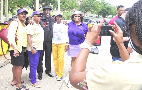 Golfing pioneer Calvin Peete (center) poses with a few lady golfers during a photo op at the 2013 Langston Golf Heritage Celebration on Sat. June 8 in Northeast.
