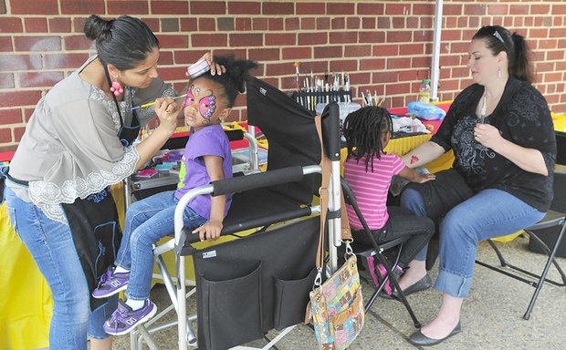Children enjoy face painting at the Langston Golf Heritage Celebration on Saturday, June 8 in Northeast.