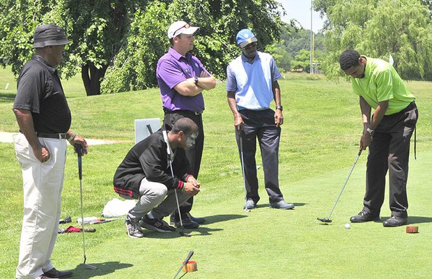 Guests at the Langston Golf Heritage Celebration participate in outdoor golf activities on Saturday, June 8 in Northeast.