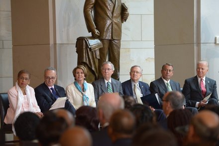 (Left to right) D.C. Delegate Eleanor Holmes Norton (D), Sen. Charles Schumer (D-N.Y.), House Minority Leader Nancy Pelosi (D-Calif.), Senate Minority Leader Mitch McConnell (R-Ky.), Senate Majority Leader Harry Reid (D-Nev.), House Speaker John Boehner (R-Ohio) and Vice President Joseph R. Biden (D) at the Frederick Douglass statue unveiling held at the U.S. Capitol on June 19.