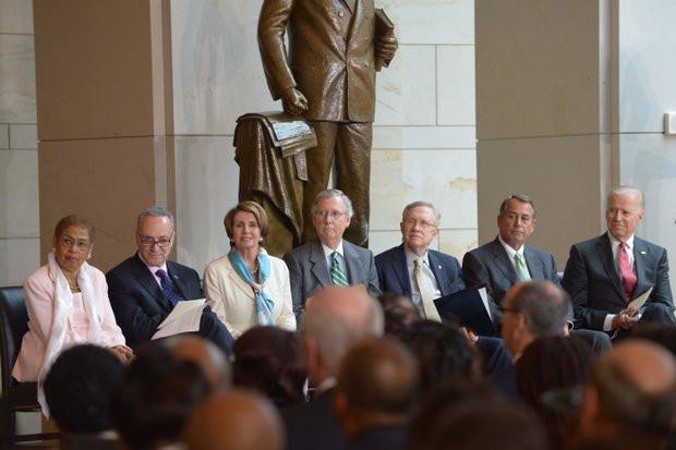 (Left to right) D.C. Delegate Eleanor Holmes Norton (D), Sen. Charles Schumer (D-N.Y.), House Minority Leader Nancy Pelosi (D-Calif.), Senate Minority Leader Mitch McConnell (R-Ky.), Senate Majority Leader Harry Reid (D-Nev.), House Speaker John Boehner (R-Ohio) and Vice President Joseph R. Biden (D) at the Frederick Douglass statue unveiling held at the U.S. Capitol on June 19.