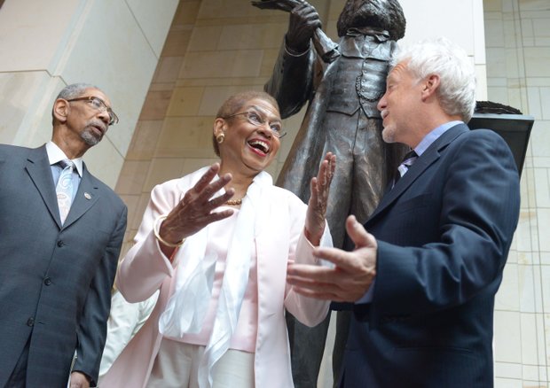 D.C. Delegate Eleanor Holmes Norton (D) with Steven Weitzman (right), designer of the Frederick Douglass statue during the statue unveiling ceremony at the U.S. Capitol on June 19.