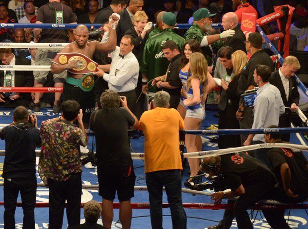 Referee Michael Ortega (right), raises the arm of Seth 'Mayhem' Mitchell naming him champion when he reclaimed the North American Boxing Organization and World Boxing Council International belts over Johnathon Banks by unanimous decision Saturday, June 22 in Brooklyn, NY.