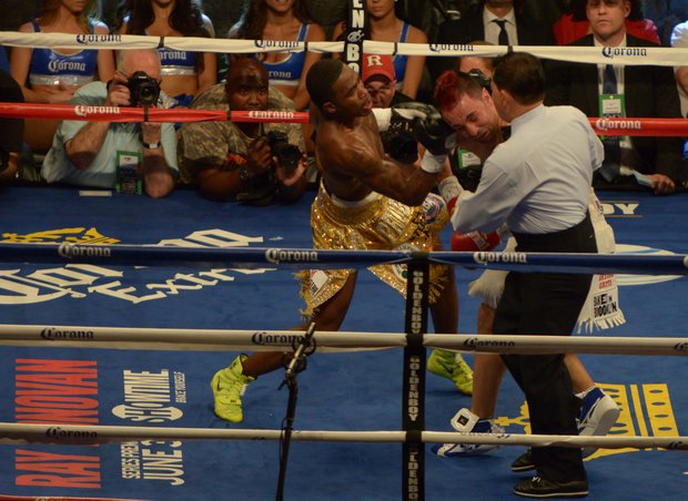 Adrien Broner catches Paulie Malignaggi with a powerful uppercut during their championship match at the Barclay's Center in Brooklyn on Saturday, June 22. Broner won a 12-round split decision and took Malignaggi's welterweight title.