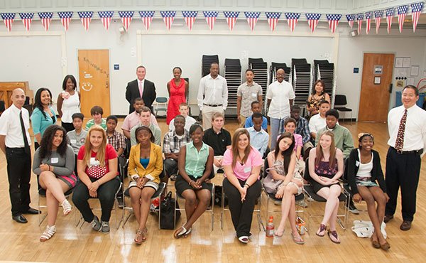 On June 21, The Oliver H. Perry K-8 School, in South Boston, held its “Professional Day” for 8th graders before their graduation ceremony. L: standing School Coordinator Bill Moran, R: standing Perry School Principal Ed Lee.