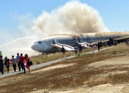The aftermath of Asiana Airlines flight 214 with 307 people on board, originated in Shanghai, China, and stopped in Seoul, South Korea. It was preparing to land in San Francisco when the rear of the plane struck the edge of the runway, severing the tail and causing the plane to erupt in smoke and flames.