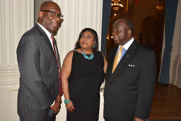 Elliston Rahming (right), the Bahamas' Ambassador to the United States, and Consul General Paulette Adderley Zonicle (center) talk during a celebration of the 40th anniversary of the Commonwealth of the Bahamas' independence at the Hall of the Americas OAS headquarters in Northwest D.C. on July 10, 2013.