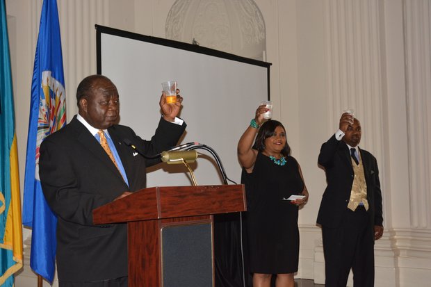 Elliston Rahming (left), the Bahamas' Ambassador to the United States, and Consul General Paulette Adderley Zonicle raise their glasses for a toast during a celebration of the 40th anniversary of the Commonwealth of the Bahamas' independence at the Hall of the Americas OAS headquarters in Northwest D.C. on July 10, 2013.