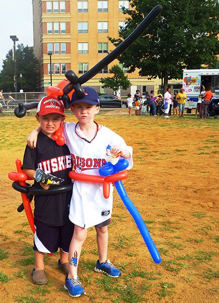 Decked-out brothers Danny, 5, and Matthew Tobin, 7, of West Roxbury are thrilled to enjoy giveaways including balloons, tattoos, and food at the ParkARTS Neighborhood Concert at Carter Playground on July 22. Mayor Menino’s Neighborhood Concerts feature a variety of music styles at various parks throughout Boston until August 4. The event was sponsored by the Boston Parks and Recreation Department in partnership with Bank of America and the Office of City and Community Affairs at Northeastern University. For information on more Boston Parks and Recreation Department events, please visit www.cityofboston.gov/parks.