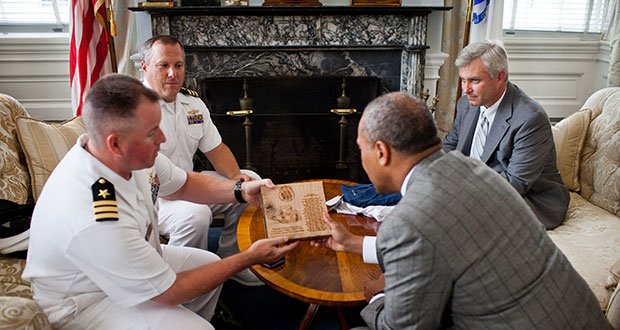 Monday, July 22, 2013 - Governor Patrick holds a courtesy meeting to welcome the incoming captain of the USS Constitution, Commander Sean Kearns, and gives thanks to the outgoing captain, Commander Matthew Bonner who presented the Governor with a piece of wood from the USS Constitution inscribed with the poem “Old Iron Sides”