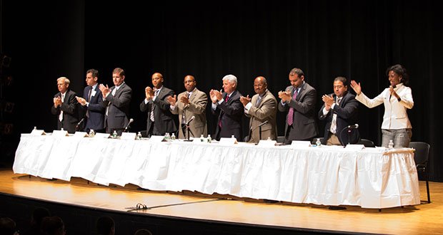 The 2013 mayoral candidates offer a thunderous applause following the end of the forum. Candidates discussed the state of Boston Public Schools and high school dropouts.