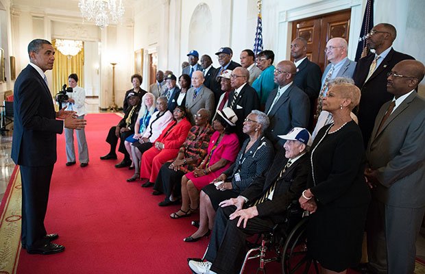 President Barack Obama meets with former Negro League baseball players in the Cross Hall of the White House, Aug. 5, 2013.
