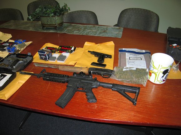 Lancaster cockfighting raid nets handguns, marijuana and roosters.