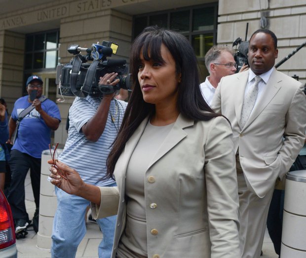 Sandi Jackson, wife of former Illinois Rep. Jesse Jackson Jr., leaves the U.S. District Courthouse in D.C., on Wednesday, Aug. 14 after she was sentenced to 12 months in prison for failing to report almost $600,000 in taxable income.
