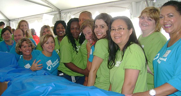 Neighborhood Health Plan Vice President of Business Development Jill d'Arbeloff and volunteers from the organization helped fill 30,000 backpacks with new school supplies for children throughout the state as part of Cradles to Crayons’ Backpack-a-thon on Boston’s City Hall Plaza on August 9.