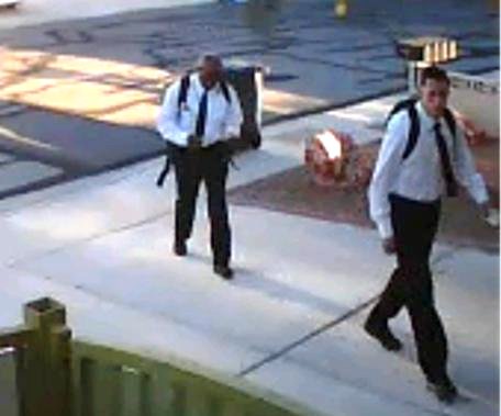 On June 27, 2013 at approximately 6:20 a.m., the suspects pictured committed a residential robbery in the area of Flamingo and Buffalo. The suspects, dressed like Mormon missionaries, knocked on the victim’s door asking to speak to him about religion. The victim spoke to them for approximately five minutes and was then jumped and punched by the suspects. The suspects demanded property from the victim while holding him at gunpoint. Once receiving property from the victim, the suspects fled. Suspect #1 is described as a White male, 22-28 years old, 5’7”-5’8”, 130-145 lbs. He was last seen wearing a white shirt, black tie, black pants and black shoes. He was carrying a black backpack and was armed with a handgun. Suspect #2 is described as a Black male, 22-28 years old, 5’10”-6’1”, 190-210 lbs. He was last seen wearing a white shirt, black tie, black pants and black shoes.