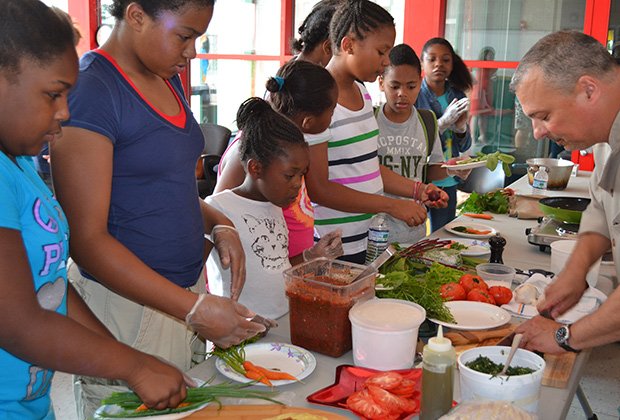 Chef Eric Brennan of Post 390 and Chris Himmel, the restaurant’s owner, visited the Blue Hill Boys and Girls Club and used fresh ingredients from their outdoor garden to create grilled pizzas.
Pictured above are kids from the Blue Hill Boys and Girls Club of Dorchester.
