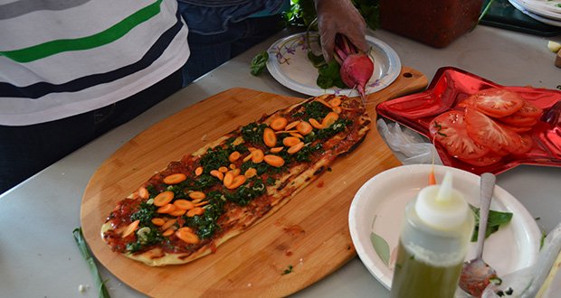 Chef Eric Brennan of Post 390 and Chris Himmel, the restaurant’s owner, visited the Blue Hill Boys and Girls Club and used fresh ingredients from their outdoor garden to create grilled pizzas.