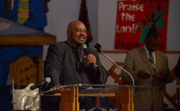 Rev. Willie Wilson, pastor of Union Temple Baptist Church in Southeast, offers remarks during a pre-march rally celebration at the church on Tuesday, August 20.