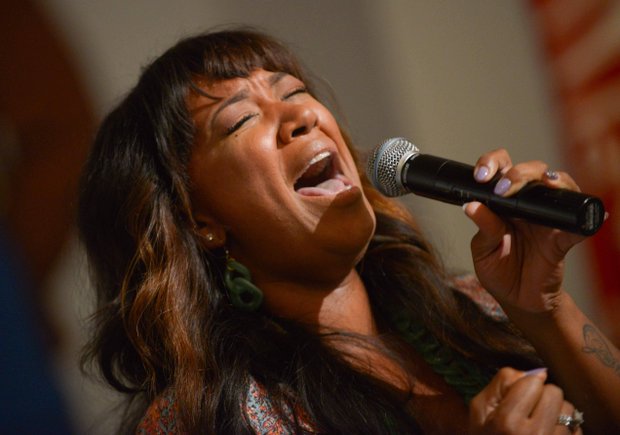 Gospel singer Y’anna Crawley, moves the audience during the pre-march rally with a powerful song at Union Temple Baptist Church in Southeast on Tuesday, August 20.