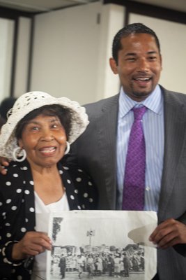 Nettie Hailes with Comcast Government Affairs Director Antonio Williams displaying a photo taken during the 1963 March on Washington at the Black Women's Roundtable on Thurs., August 22 at the Hyatt Regency Capitol Hill in Northwest.