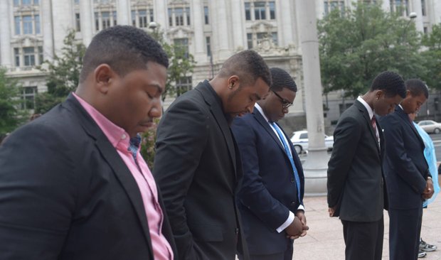 Students from South Carolina State University pray during the Drum Majors for Justice Future Leaders Celebration at Freedom Plaza in Northwest on Fri., August 23.