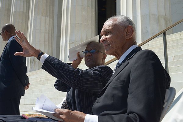 Civil rights icon Rev. C.T. Vivian (far right), takes in the sights of thousands on the steps of the Lincoln Memorial during the March on Washington 50th Anniversary on Sat., August 24.