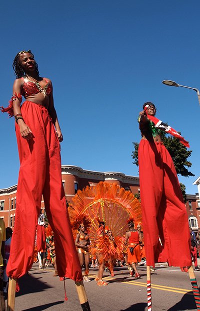 Stilt walkers with the New York-based group, Brooklyn Jumpers, march on the Caribbean Carnival parade route.