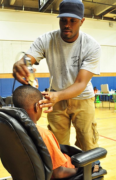 Dorchester House hosted the “First Impressions Fair” on Monday, August 26 to help prepare youth for the upcoming school year. Manny Cardoso from Unique Cuts was one of the local barbers that provided 40 free haircuts. In addition, Dorchester House pediatrics and dental staff provided healthcare, hygiene and school supplies to students.