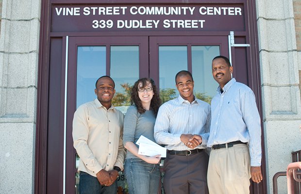 Vine Street Community Center Council awarded their first scholarship on Aug. 24. The Pizzi Family Foundation was a donor. (L-R) Awardee Asad Hardwick, Andrea Pizzi, awardee Jamal Ellison and David Hinton, coordinator of Vine Street Community Center. Not present were awardees Marysabel Mejia and Nair Andrade.
