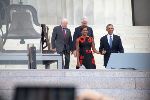 President Obama arrives with his wife Michelle and former Presidents Jimmy Carter and Bill Clinton