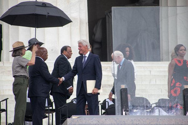 Former President Bill Clinton greets Congressman John Lewis