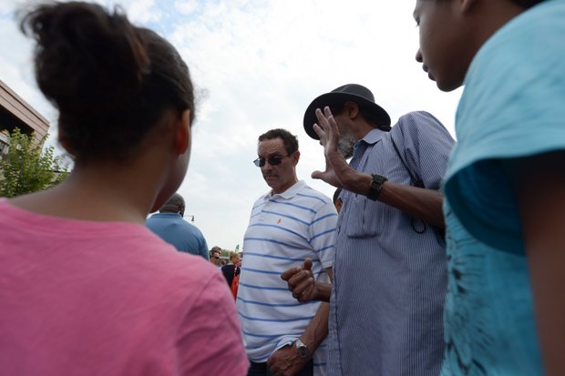D.C. Mayor Vincent Gray talks with constituents at the 2013 Adams Morgan Day festivities on Sunday, Sept. 8.