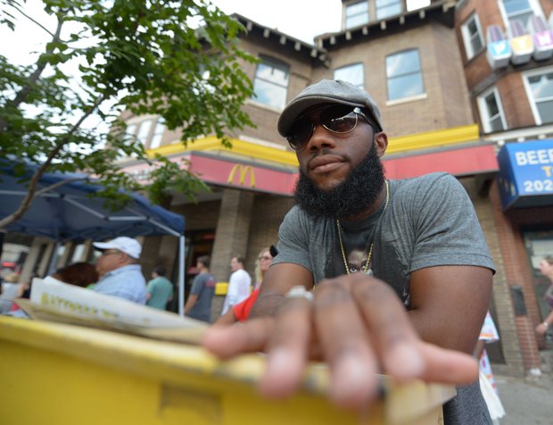 Nathan Manneh of Laurel, Md., poses for a portrait at Adams Morgan Day in D.C. on Sunday, Sept. 8.