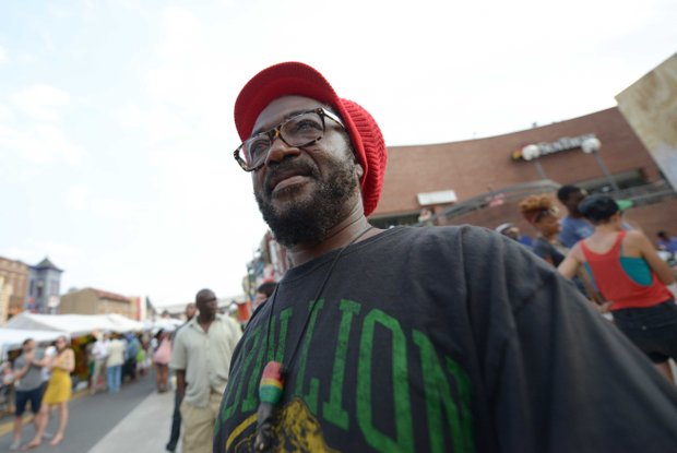 Kufi Asante enjoys live entertainment during the 2013 Adams Morgan Day festivities in D.C. on Sunday, Sept. 8.