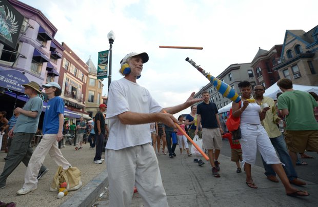 Juggler Dani AvRutick impresses the crowd with his juggling skills during the 2013 Adams Morgan Day festivities in D.C. on Sunday, Sept. 8.