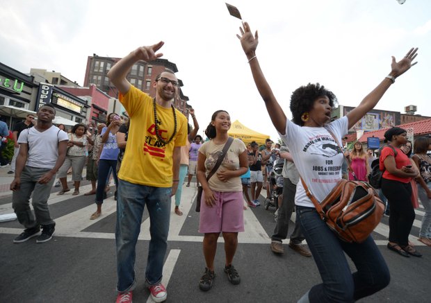Revelers danced along 18th Street in D.C. during the 2013 Adams Morgan Day festivities on Sunday, Sept. 8.