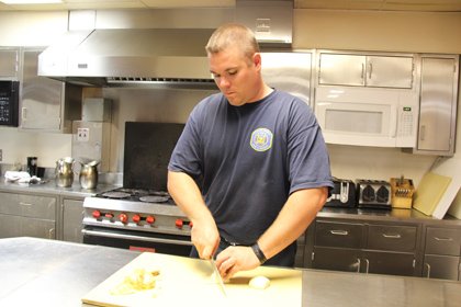 Howard County Firefighter Kevin Weisenborn has become used to cooking for the group of guys he describes as “10 very ... Howard County Firefighter Kevin Weisenborn has become used to cooking for the group of guys he describes as “10 very ...