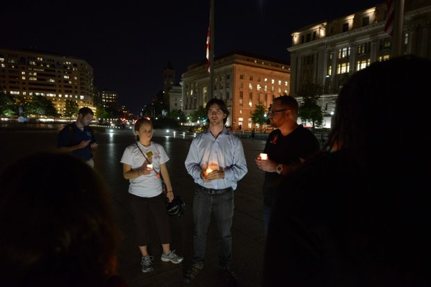 A small crowd gathered for a candlelight vigil at Freedom Plaza in Northwest on Monday, Sept. 16, to honor the victims of the Washington Navy Yard shooting.