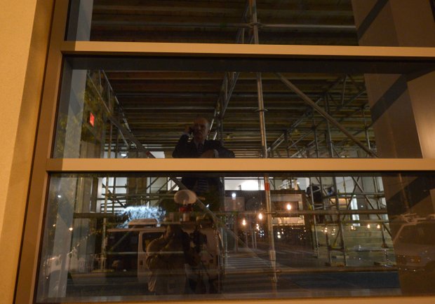 D.C. Council Chairman Phil Mendelson takes a call before a press briefing for the Washington Navy Yard shooting on Monday, Sept. 16.