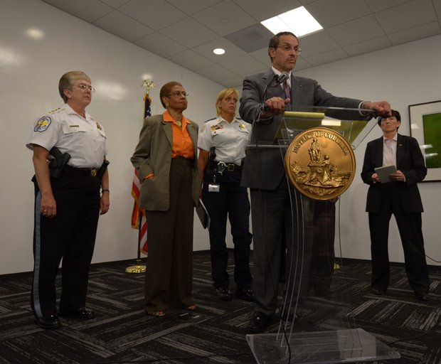 D.C. Mayor Vincent Gray (center) speaks during a press briefing for the Washington Navy Yard shooting on Monday, Sept. 16.
