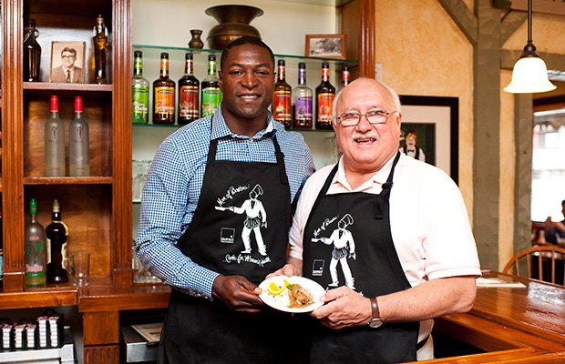 Eric Alexander, New England Patriots Alumnus, and Gerard Adomunes, Owner of Gerard’s Restaurant, present a small taste of the food that will be served by over 25 of Boston’s finest restaurants and an illustrious lineup of celebrity chefs at Men of Boston Cook for Women’s Health on Thursday, September 26th at 6pm at the Gala Tent in Codman Square. Proceeds benefit women’s health programs at Codman Square Health Center. <a href= "menofboston.org"> menofboston.org </a>