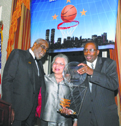 President Bob Williams, George Thompson and his wife celebrate his induction.