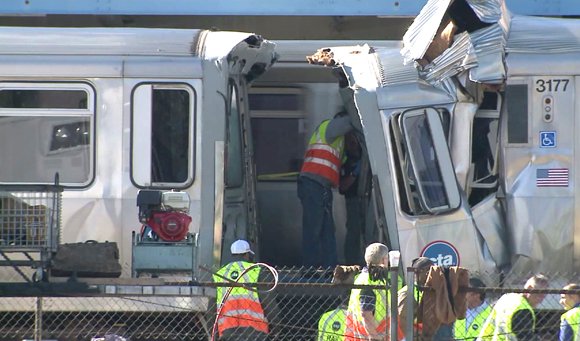 A Chicago commuter train that was parked in a service yard somehow moved onto a rail line and smashed into ... A Chicago commuter train that was parked in a service yard somehow moved onto a rail line and smashed into ...