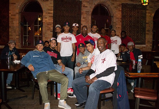 Boston Astros players, coaches, alumni and friends gathered on Sunday evening to watch the Red Sox beat the Cardinals in Game 4 of the World Series. The private event drew more than 100 people – including most of the Astros’ Triple Crown Sports US Baseball Championship team, and Astros alumni who have gone on to play professional baseball including Juan Carlos Portes, formerly of the Minnesota Twins, Eddy Morabel, who recently signed as a free agent with the Texas Rangers, and Vladimir Camacho, recently drafted into the Frontier League. Also in attendance: Robert Lewis, Jr., founder and president of The BASE and the Boston Astros; WCVB’s CityLine Host Karen Holmes Ward and her husband, Forrest Ward, Mark Culliton, Executive Director of College Bound Dorchester, Chris Byner of Boston Centers for Youth and Families, Denise Korn of Korn Design and Youth Design, and Scott Tully, Novaya Real Estate Ventures. Boston Astros team is comprised of elite players, primarily from Dorchester, Roxbury and Mattapan. Each player ‘earns their spot,’ and there is no fee to participate on the team, contrary to most elite suburban teams. The Astros earned several impressive championships this season, and more importantly, are celebrating success off the field with 16 of 17 graduating seniors going on to college.