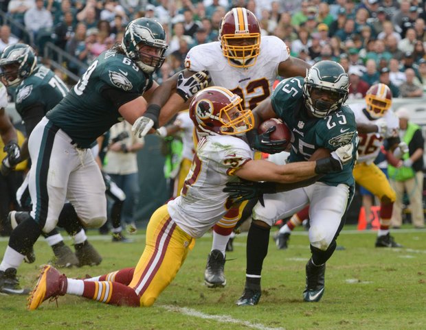 Philadelphia Eagles running back LeSean McCoy barrels through a Redskins defender.